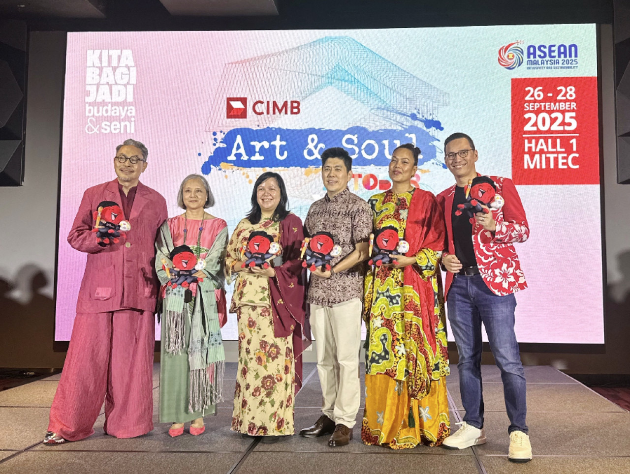 Speakers on stage at CIMB Artober 2025 in front of the event backdrop showing the dates, Hall 1 MITEC, and ASEAN Malaysia 2025